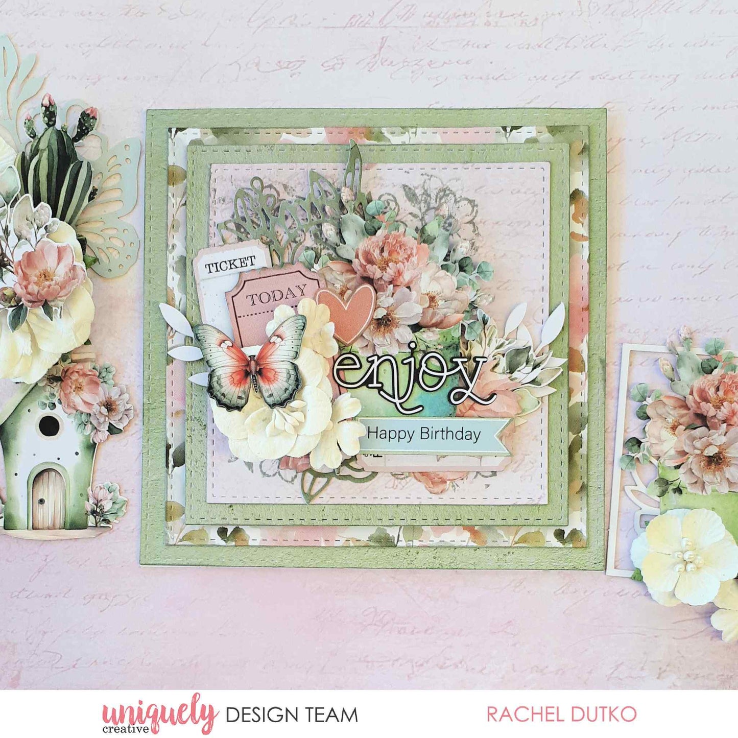 Tea and Tranquility handmade card by Uniquely Creative design team — layered square "Enjoy Happy Birthday" card featuring lush floral clusters, butterfly and ticket die-cuts, and a heart embellishment in soft sage, blush, and cream 