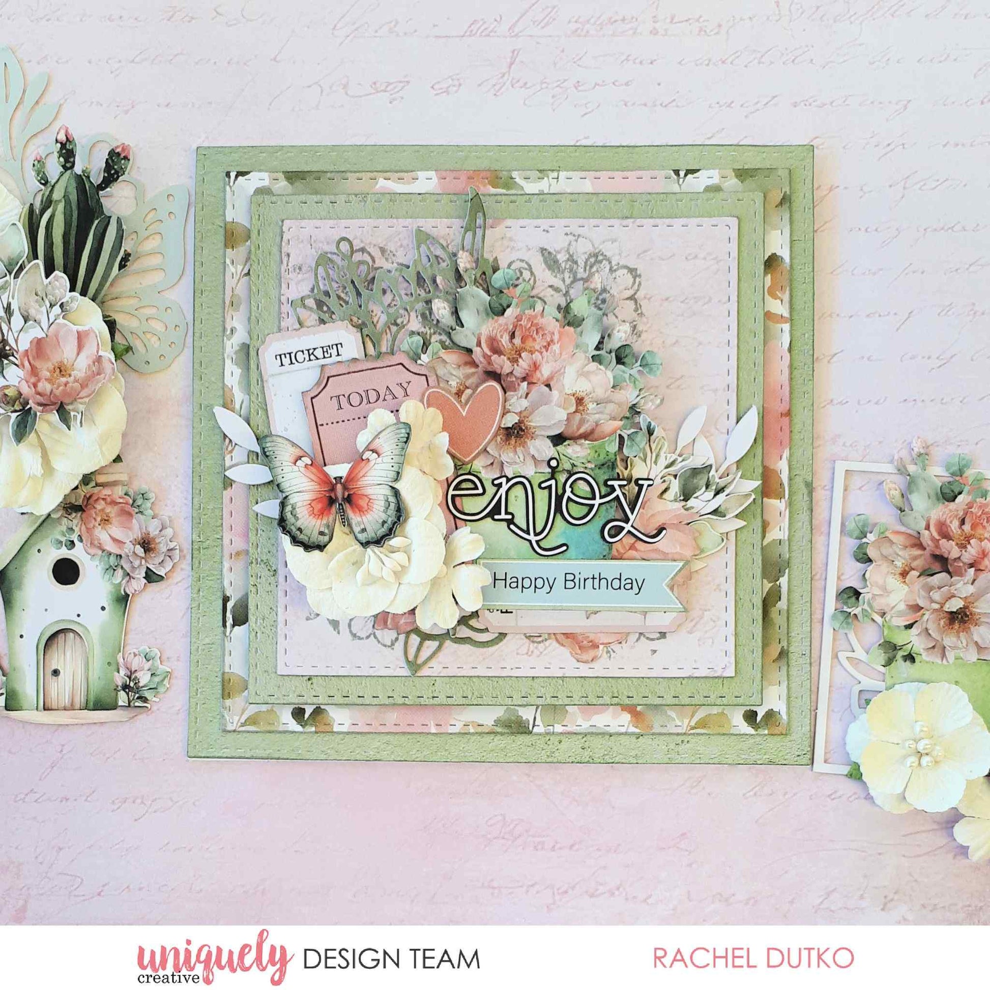 Tea and Tranquility handmade card by Uniquely Creative design team — layered square "Enjoy Happy Birthday" card featuring lush floral clusters, butterfly and ticket die-cuts, and a heart embellishment in soft sage, blush, and cream 