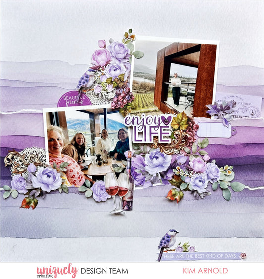 Scrapbook layout featuring Uniquely Creative Ultraviolet Delight collection with purple watercolour papers, lavender floral embellishments, and enjoy life sentiment created by Kim Arnold