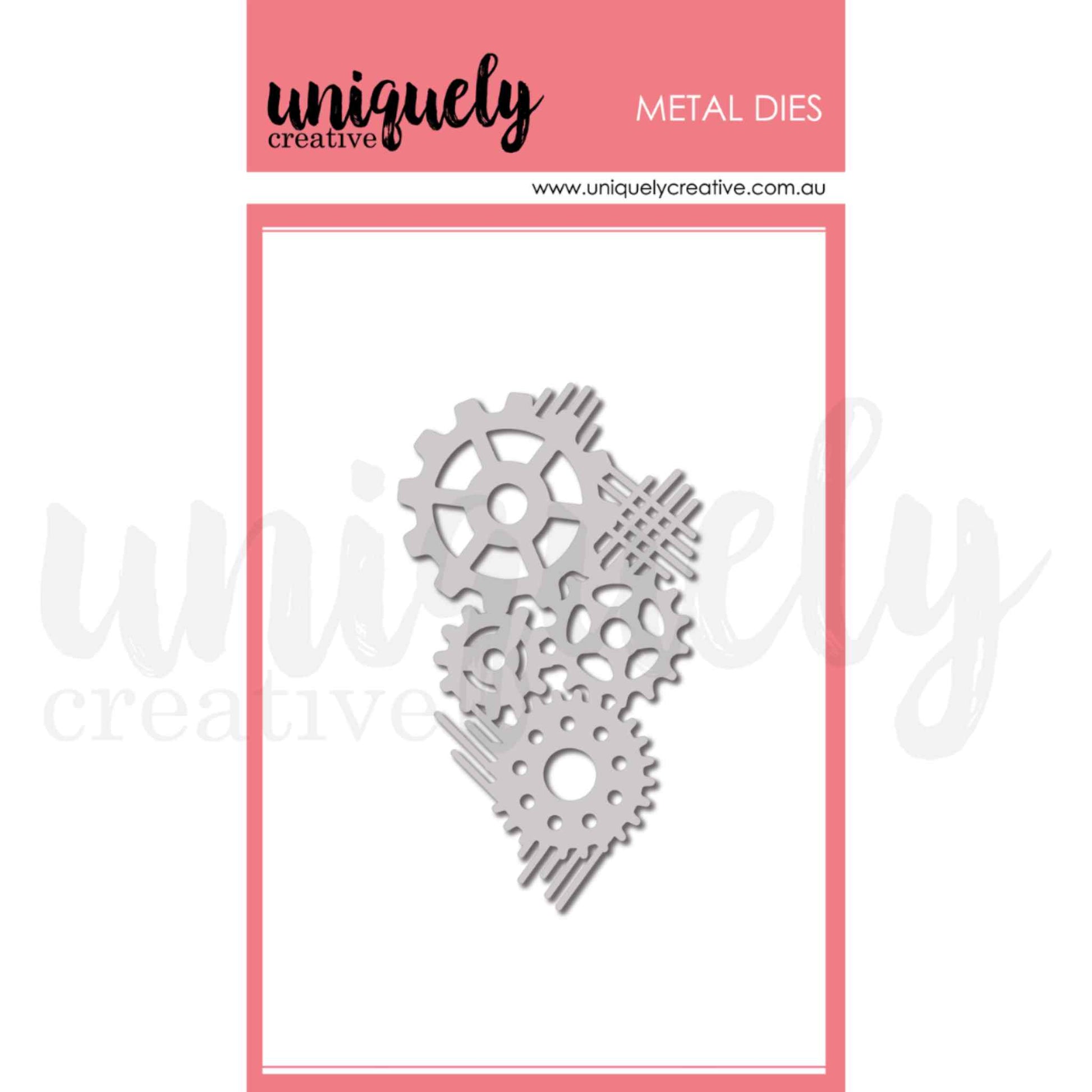 Uniquely Creative Cogs Texture Die UCD2242 metal die approximately 2.25 by 3.75 inches showing a cluster of three interlocking gear cogs with speed line accents