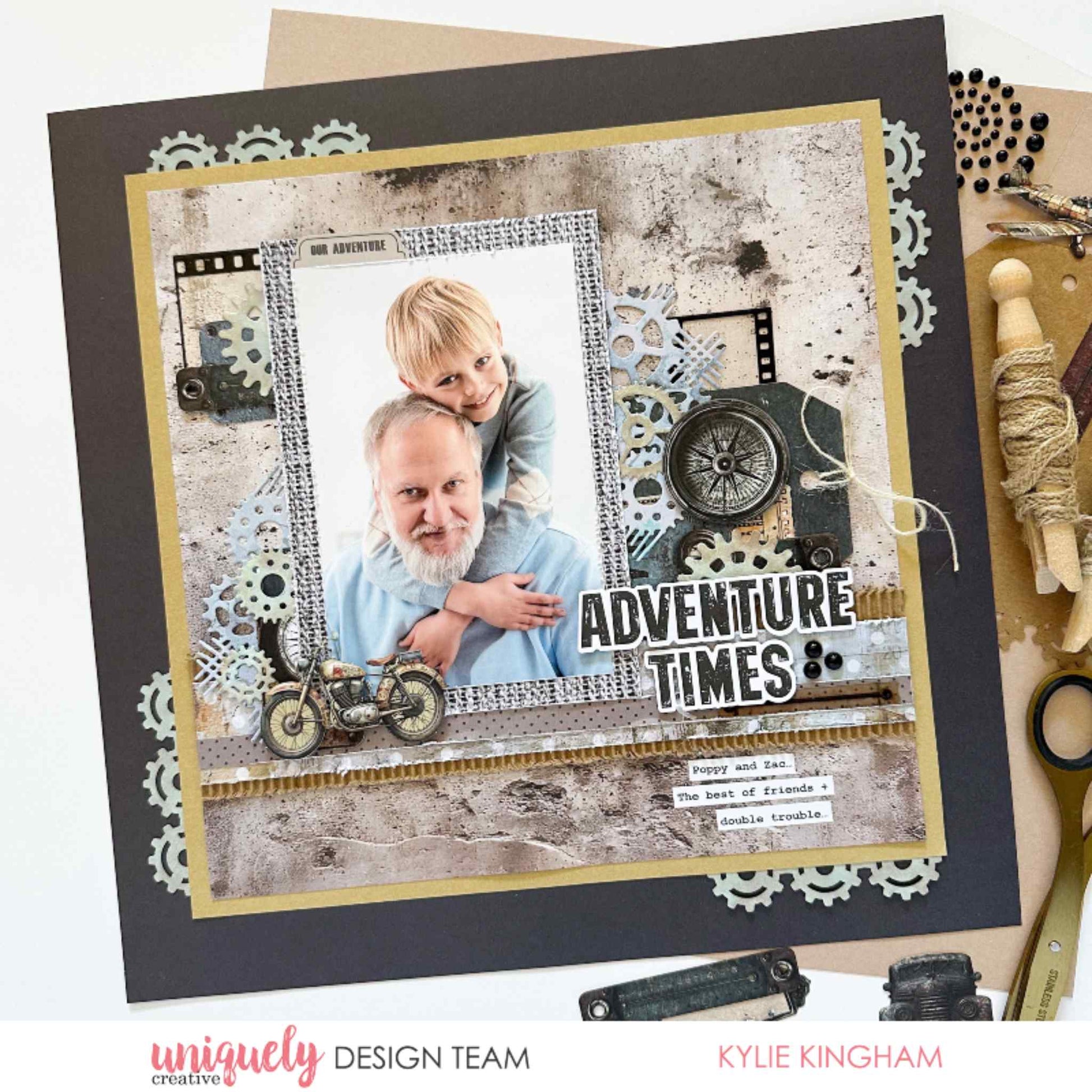 Scrapbook layout using Uniquely Creative Wings and Wheels paper, featuring father and son photo with Adventure Times title, motorcycle, compass, gears and film strip embellishments