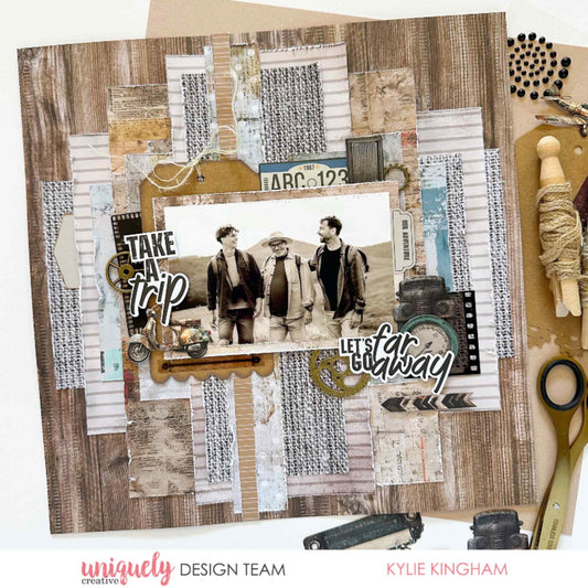 Scrapbook layout using Uniquely Creative Wings and Wheels paper, featuring three men walking with Take a Trip and Let's Go Far Away titles, number plate, vintage scooter, camera and film strip embellishments 