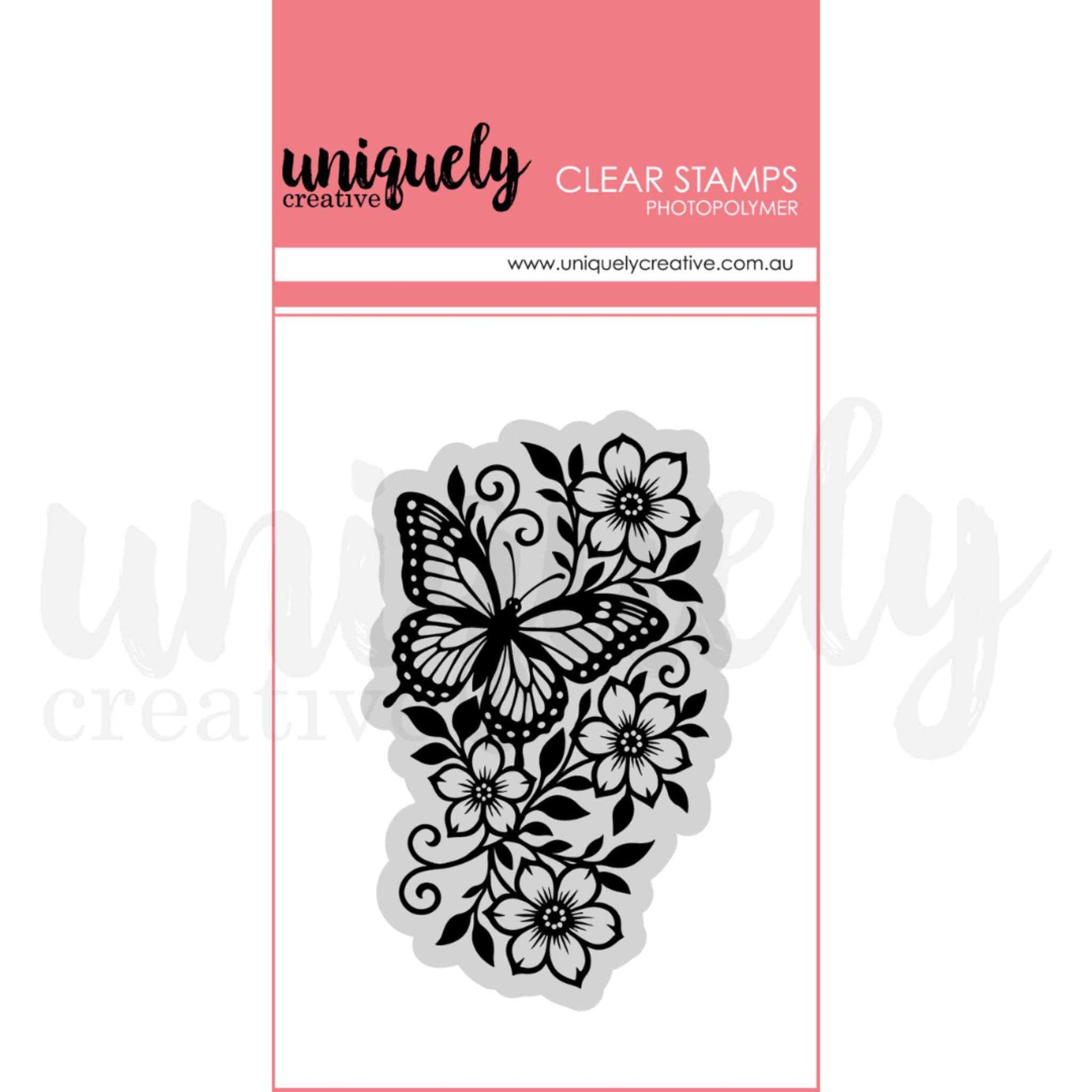 Wings and Wildflowers photopolymer clear stamp by Uniquely Creative — detailed butterfly and wildflower botanical stamp featuring a monarch butterfly among open blooms, swirling vines, and layered leaves