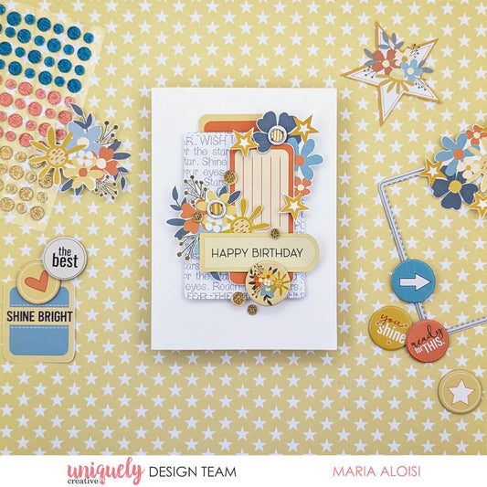 Happy birthday handmade card using Uniquely Creative Written in the Stars collection featuring die-cuts with floral embellishments in orange, yellow and blue, gold sparkle accents and layered sentiment tag