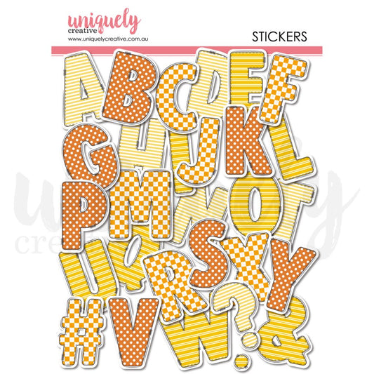 Uniquely Creative Written in the Stars Chipboard Alphabet Stickers showing complete A-Z letters and punctuation in yellow stripes, orange polka dots and yellow checkerboard patterns with stitched outlines