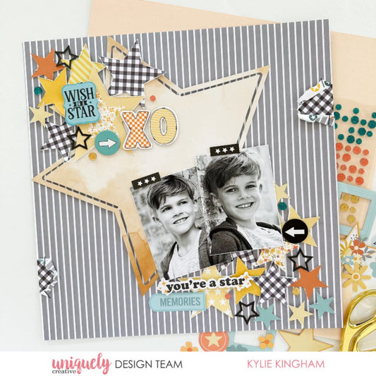 You're a star scrapbook layout with black and white photo on grey striped paper using Uniquely Creative Written in the Stars collection featuring arrow embellishments, XO letters, black gingham, stars and Wish On a Star sentiment